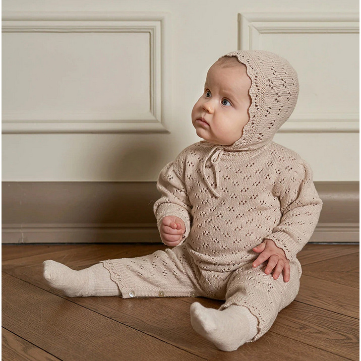 Gebreide babysuit
